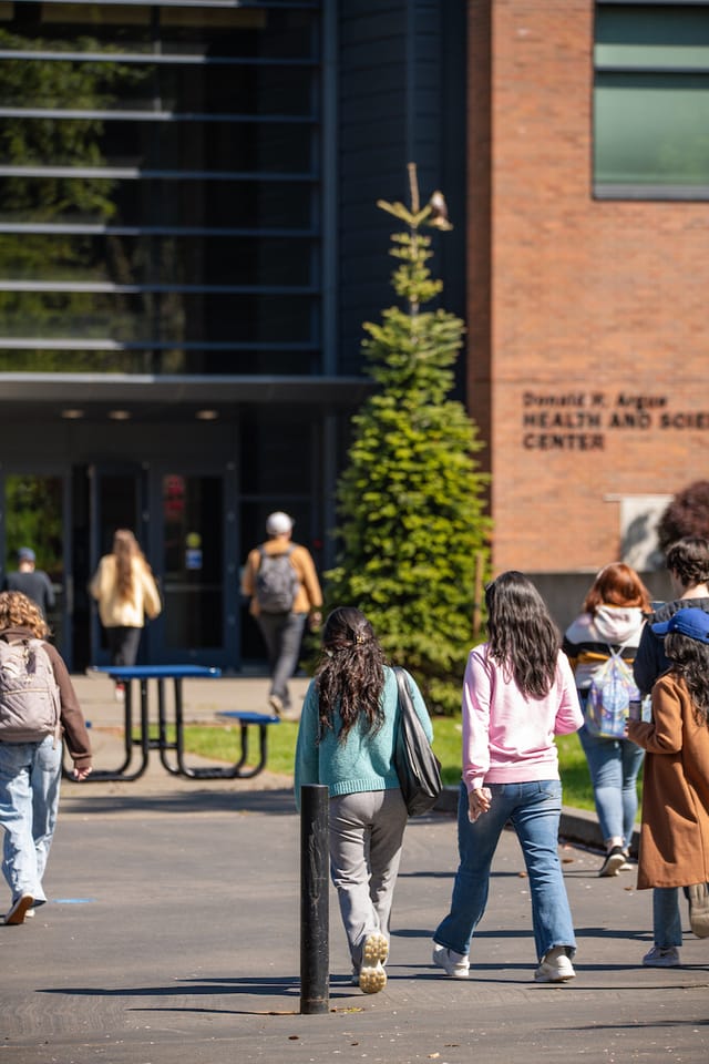 Students walking toward the Donald H. Argue Health and Science Center